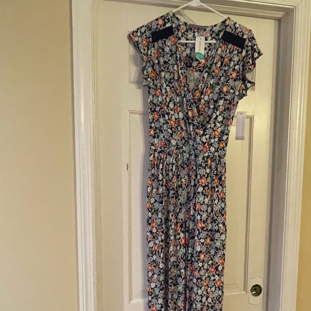 New with tags. Full length pant jumpsuit. Spring! Super cute!